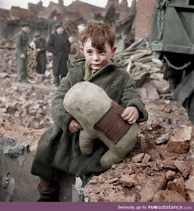 Colorised photo of an Abandoned Boy Holding a Stuffed Toy Animal. London 1945