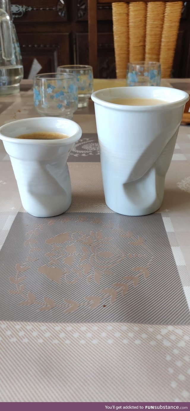 These ceramic coffee cups that are shaped like crushed plastic ones