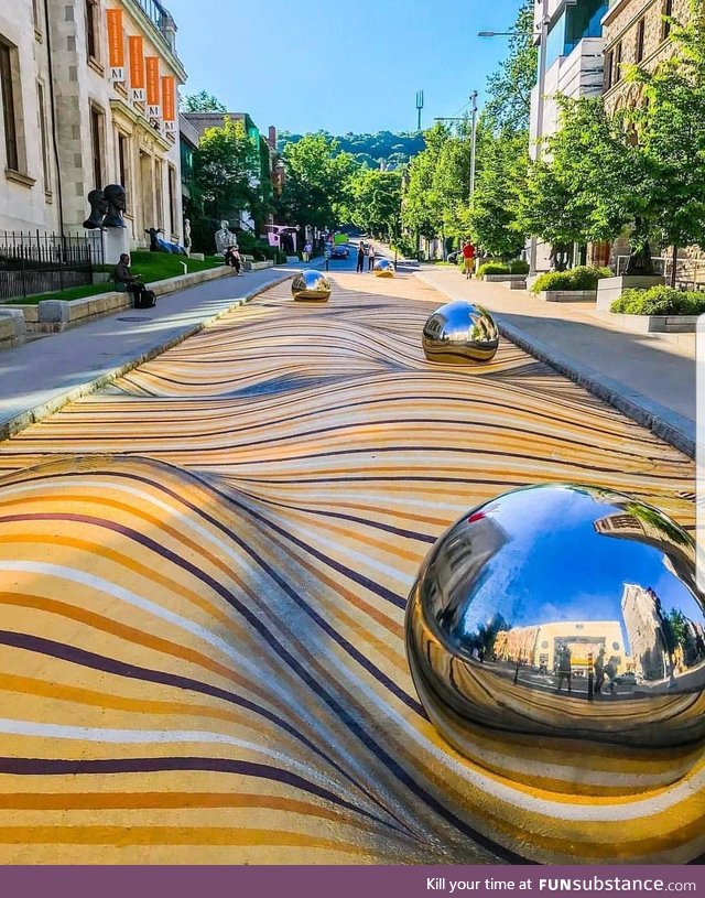 Optical illusion painted on a street near the Montreal Museum of Fine Arts