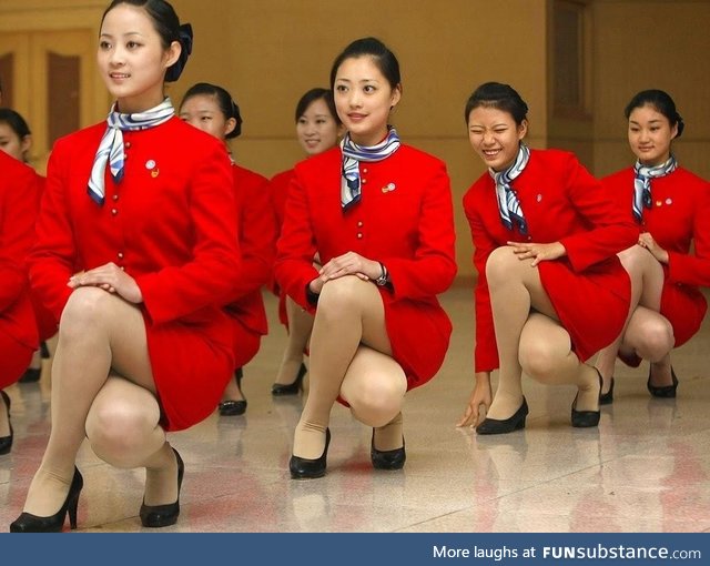 Cathay Pacific flight attendents training elegance when squatting down