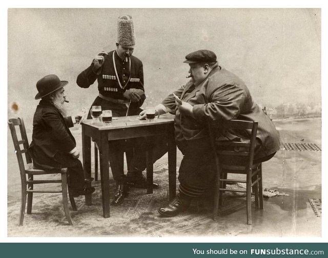 The shortest, tallest, and fattest men of Europe drinking and playing cards together 1913