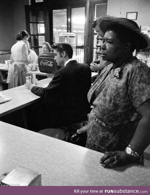 Black woman not allowed to sit and have her breakfast with Elvis behind her. 1956.
