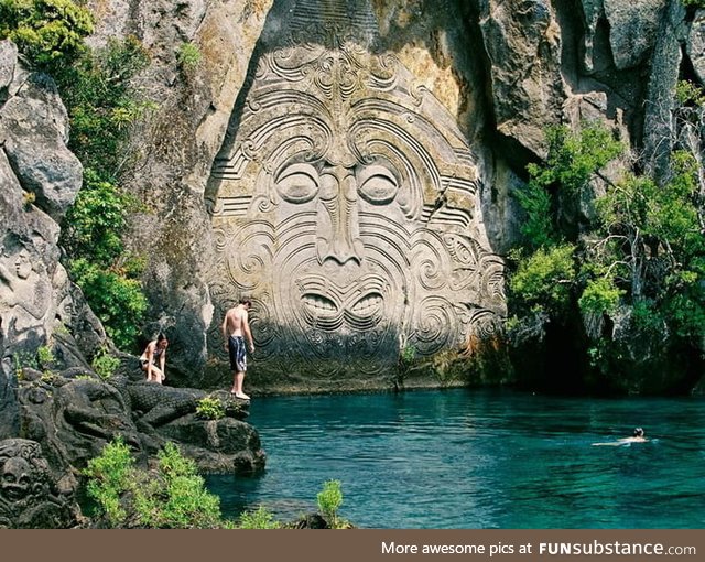 Maori rock carvings at Mine Bay, New Zealand