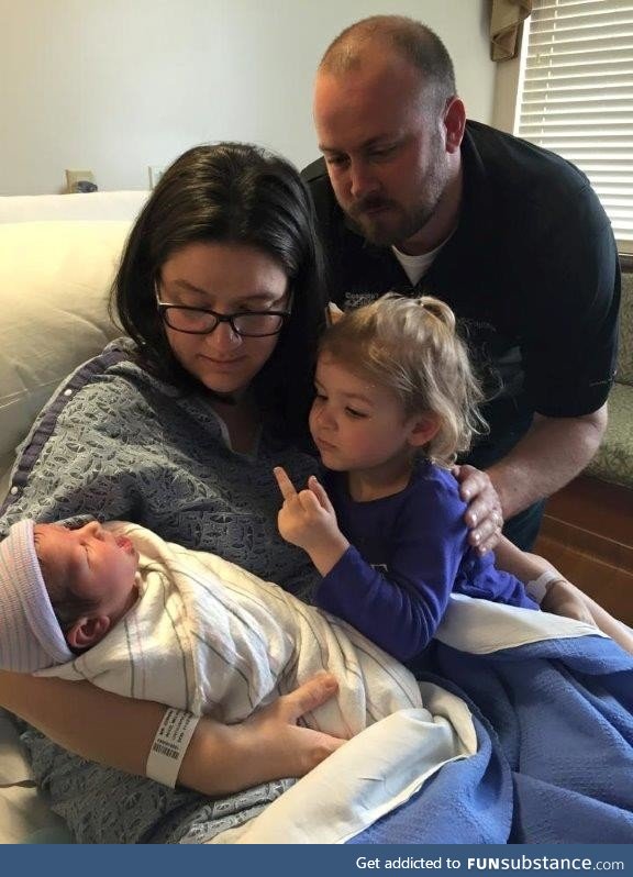 Sister welcomes newborn sibling to the family