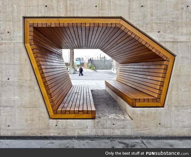 Wooden bench built into a concrete wall