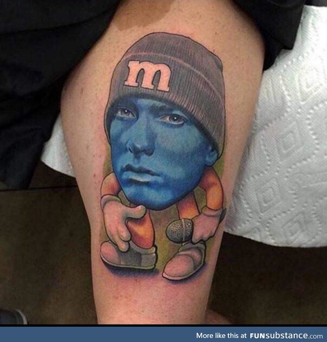 When you can't choose between the Eminem tattoo and the M&M tattoo so you opt for: