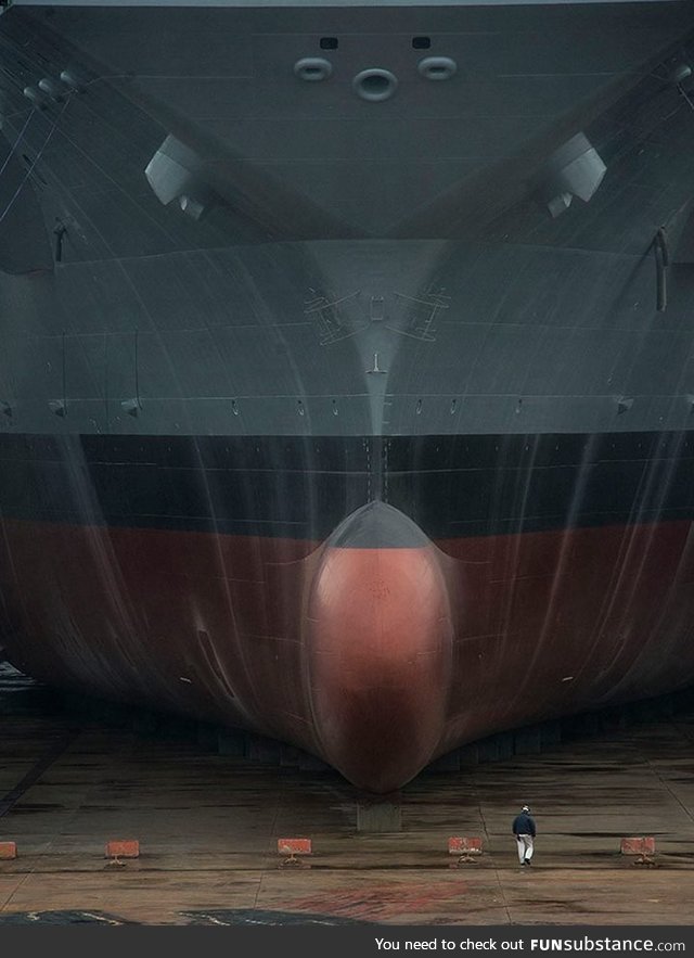The USS Gerald R Ford in drydock, human for scale