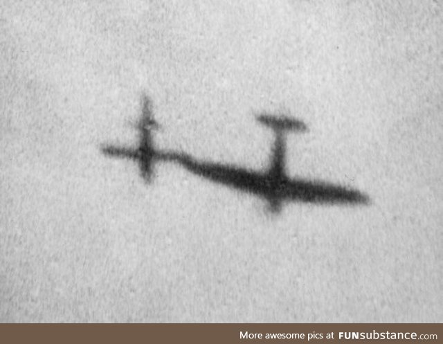 A supermarine spitfire using the tip of it's wing to nudge a V-1 rocket off course