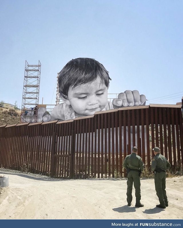Street artist installs face of a child on Mexican side of the border wall