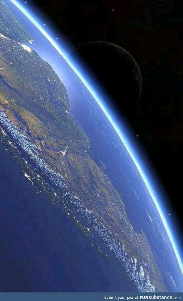 South America from the international space station featuring the moon