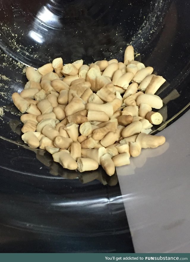 The bottom of a huge container of animal crackers is just a mass grave of animal parts