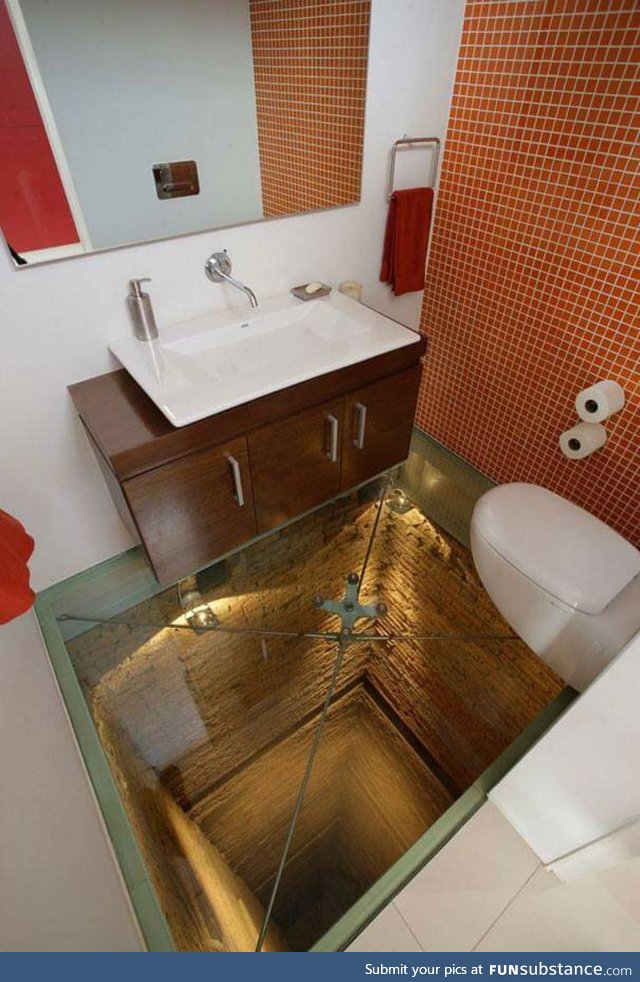 Bathroom with a glass floor over an abandoned elevator shaft