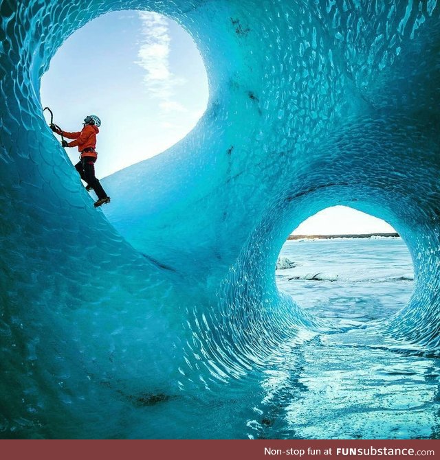 Ice cave carved out by water moving through a glacier