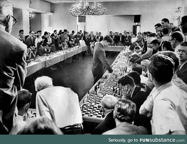 Bobby Fischer playing 50 opponents simultaneously, 1964. He won 47 of the matches, drew 2
