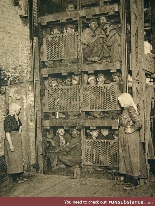 Belgium coal miners in a shaft elevator