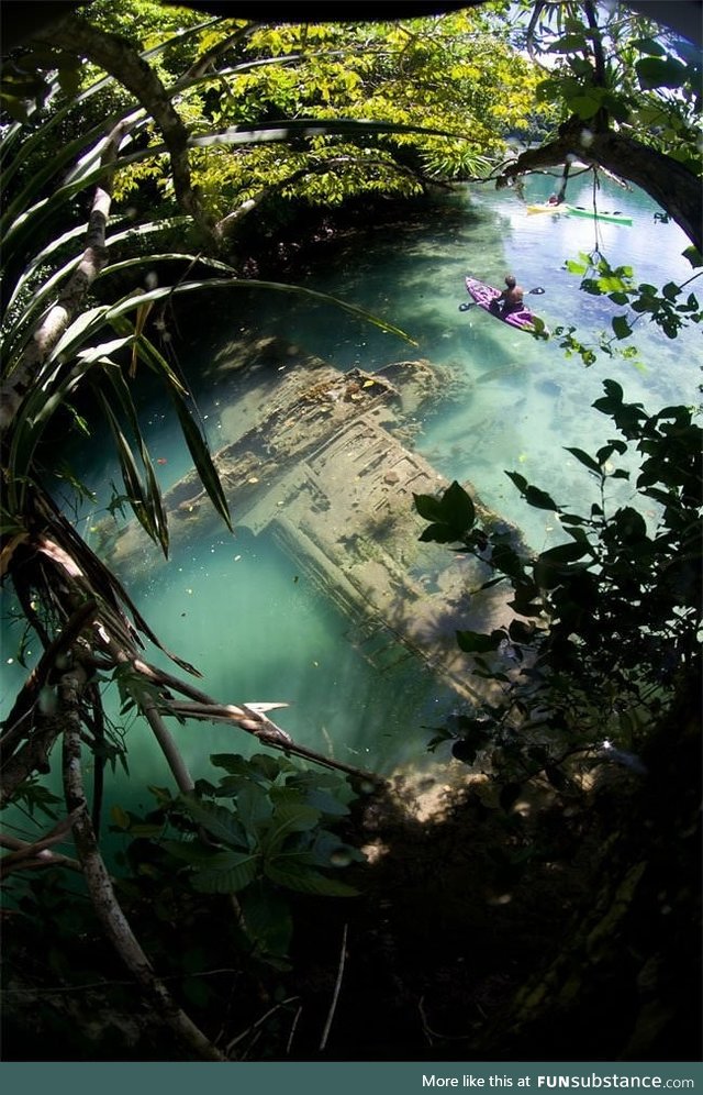 A Japanese warplane Second World War lies wrecked in shallow water