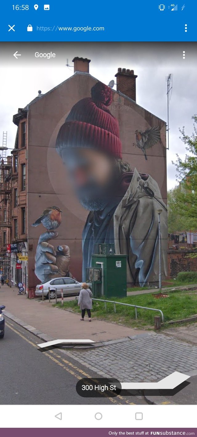 Google respect privacy so much that they will blur out a man's face on some street art,