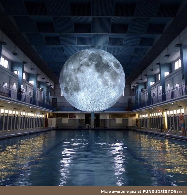 The art installation “Museum of the Moon” at a swimming pool in Italy