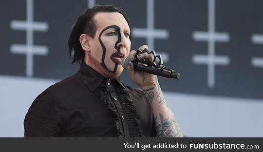 Marilyn Manson looks like Nicholas Cage dressed up as Marilyn Manson