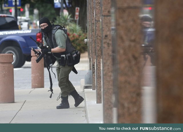 A Dallas Morning News photographer took this picture of an armed gunman shortly before