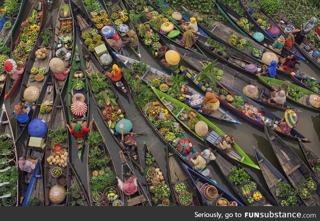 Floating market in Indonesia is filled with fruits and vivid colors
