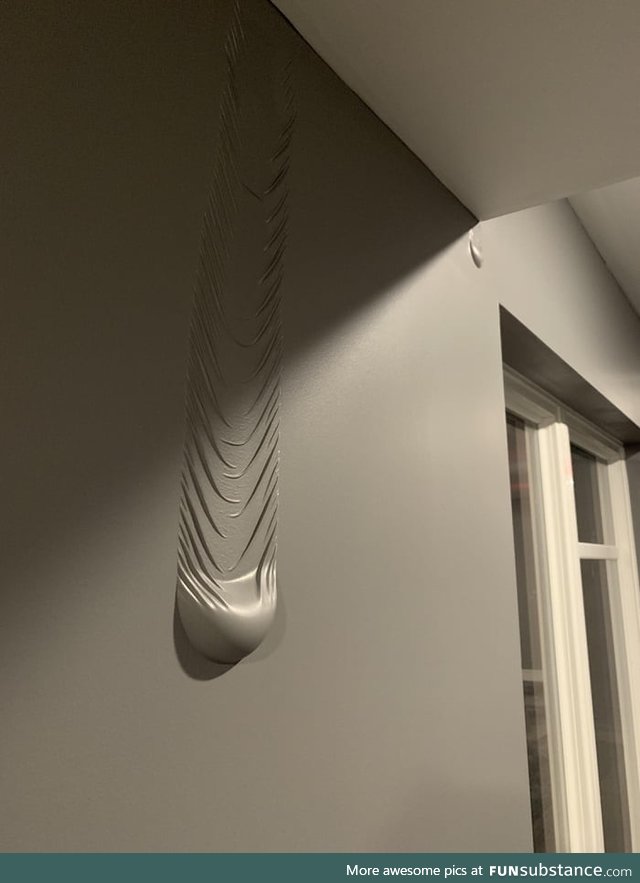 This water leaking between the wall and paint