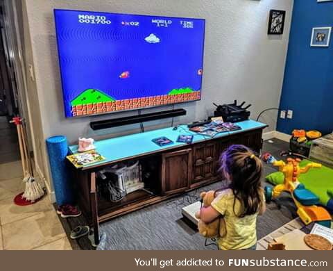 A dad is letting his daughter into the gaming universe right from the beginning