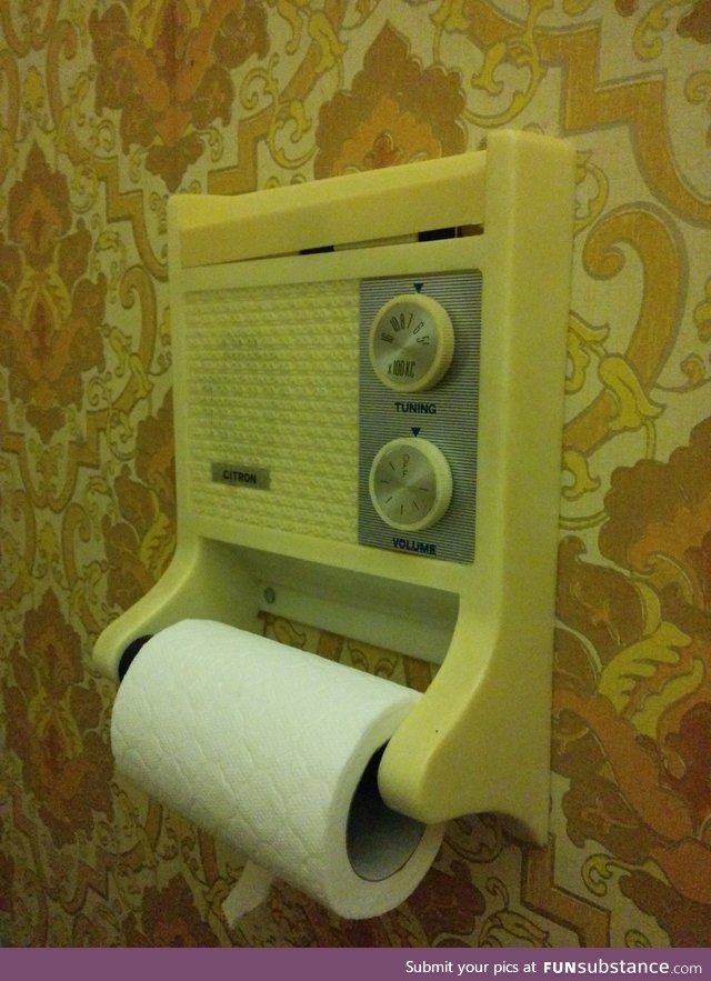 A toilet roll holder with a radio