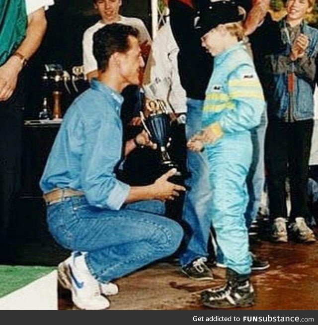 Michael Schumacher gives trophy to little Sebastian Vettel
