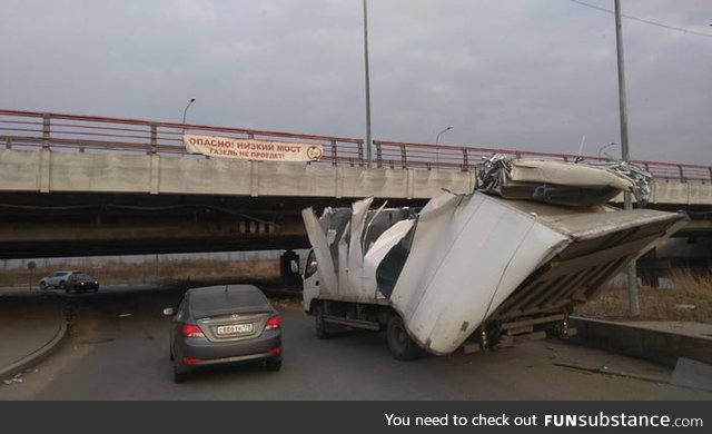 In St. Petersburg there is a bridge with banner "Low bridge, a truck will not