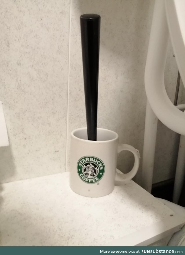 Toilet brush holder in an independent coffee shop