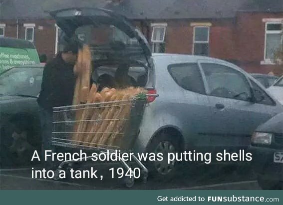 A French soilder was putting shells into a tank. 1940