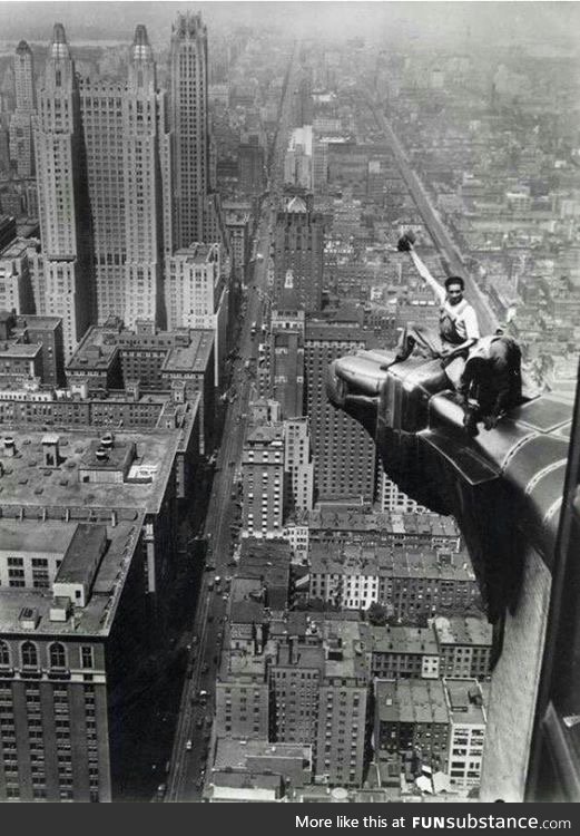 Aug 8 1932... two workers clean the eagle ornamentation on The Chrysler Building in NYC.