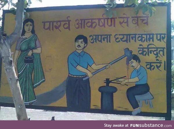 PSA signboard in India. It says, ‘Avoid distractions and focus on your work.’