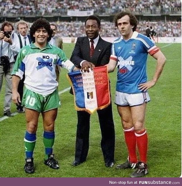 It is year 1986. Maradona is wearing "no drugs" shirt. Platini is wearing