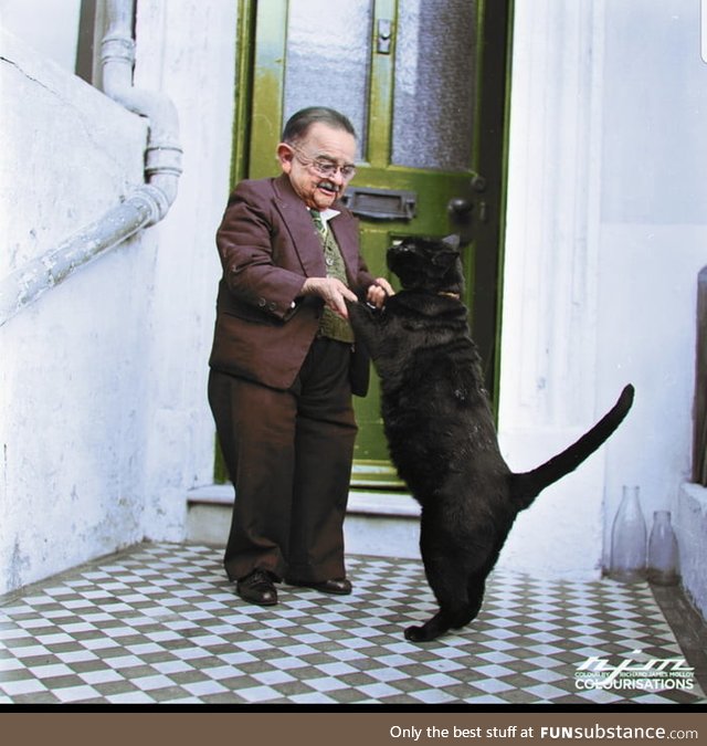 Henry behrens, the smallest person in the world dancing with his cat
