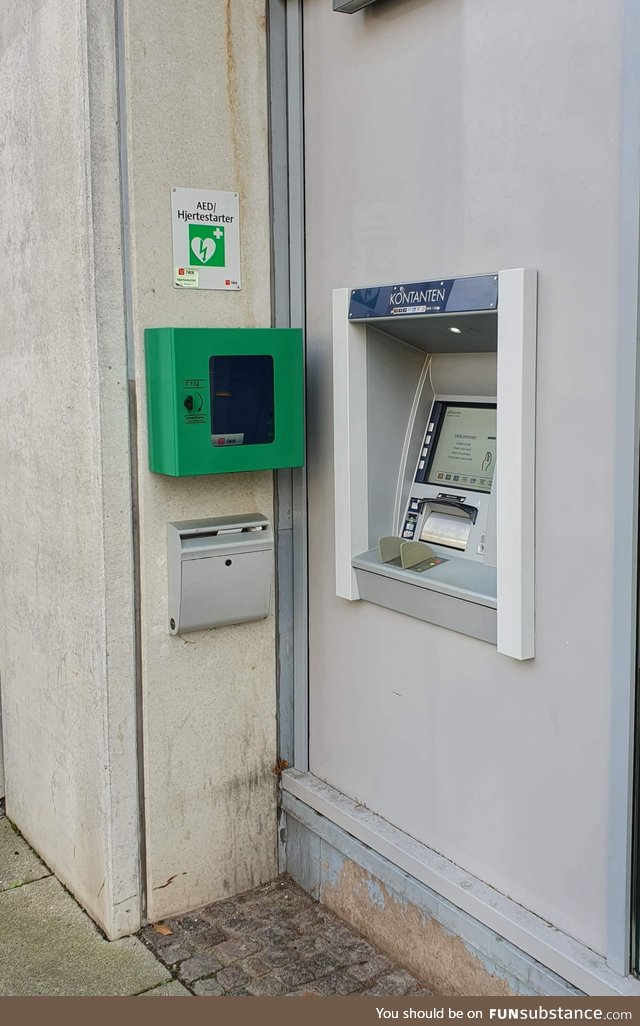 This ATM in Denmark with a defibrillator hanging right next to it, just in case you get a