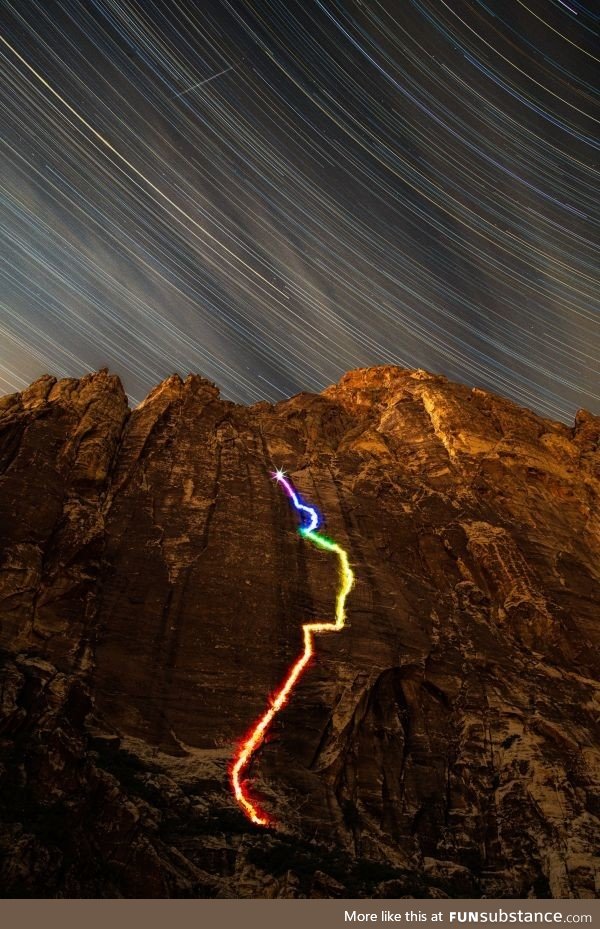 Took a long exposure of myself climbing up a 700' sandstone face with LEDs tied to my