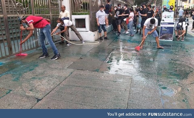 Hong Kong people clean up a Mosque after being attacked by dyes from police