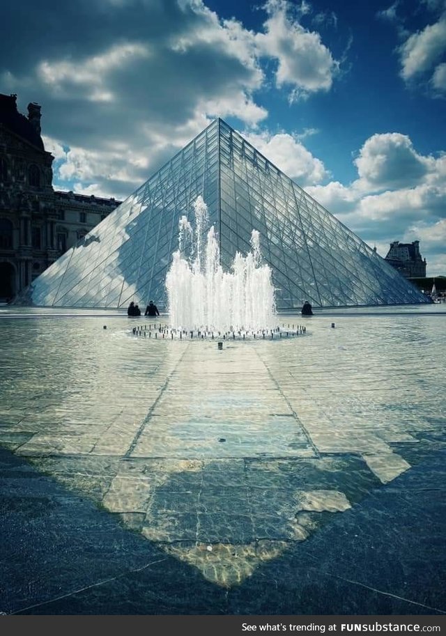 France. Louvre Musée. Pyramid reflexion