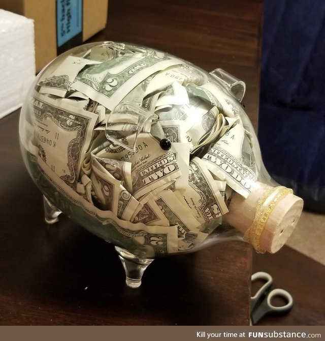Piggy bank full of two dollar bills I'm giving a friend as a wedding present