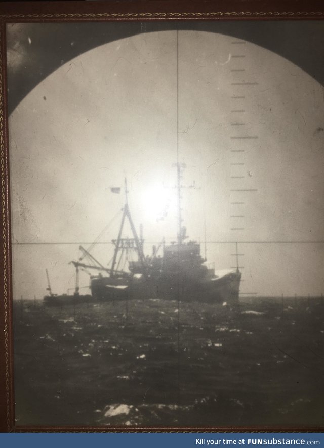 A photo of a Vietnamese fishing boat my grandpa took through a periscope