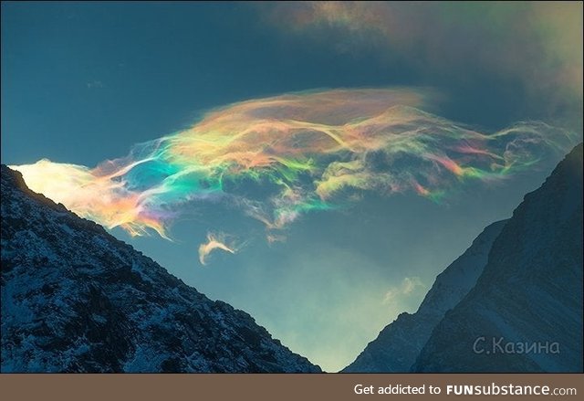 Iridescent clouds look like soap bubbles. Belukha mountain, siberia