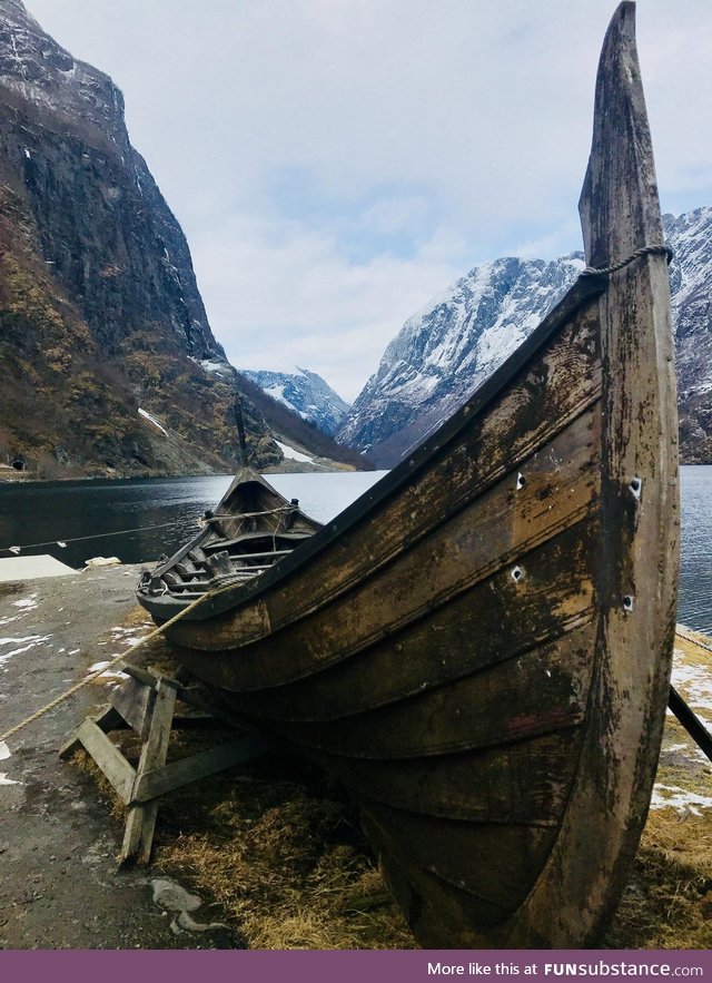 An old Viking boat amongst the fjords of Norway