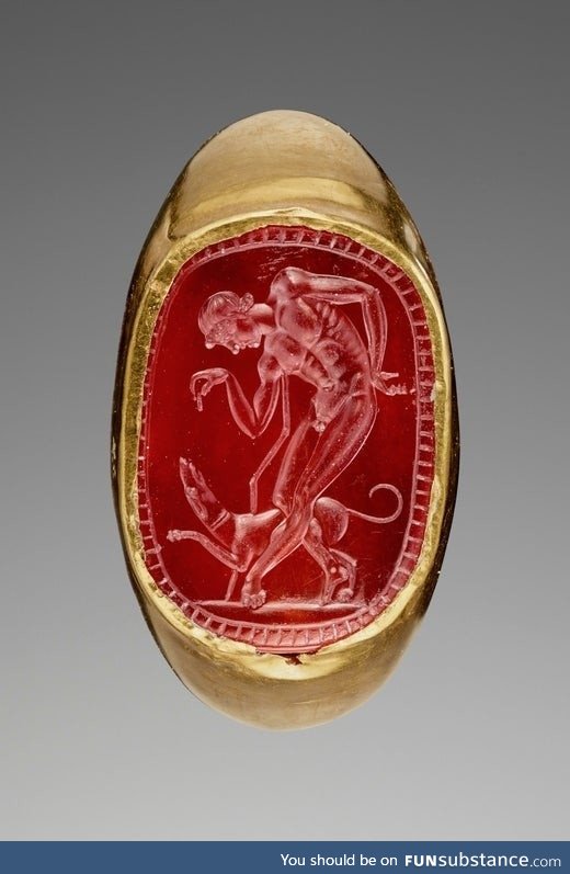 Roman ring with engraved Carnelian gem depicting a youth and his dog ~ second/third