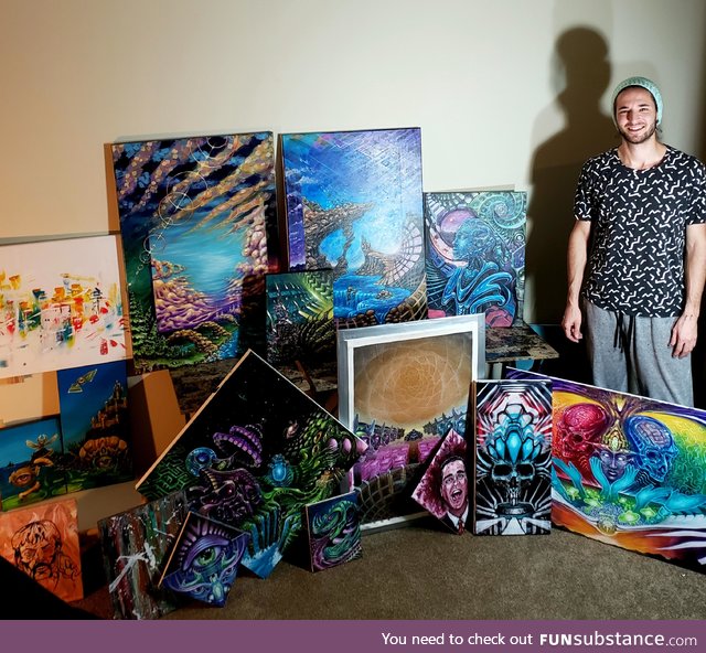 Heres me posing with most of my quarantine paintings, back to the ole 9 to 5
