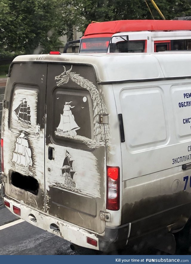 Drawn in the dirt, on the back of a van in Russia