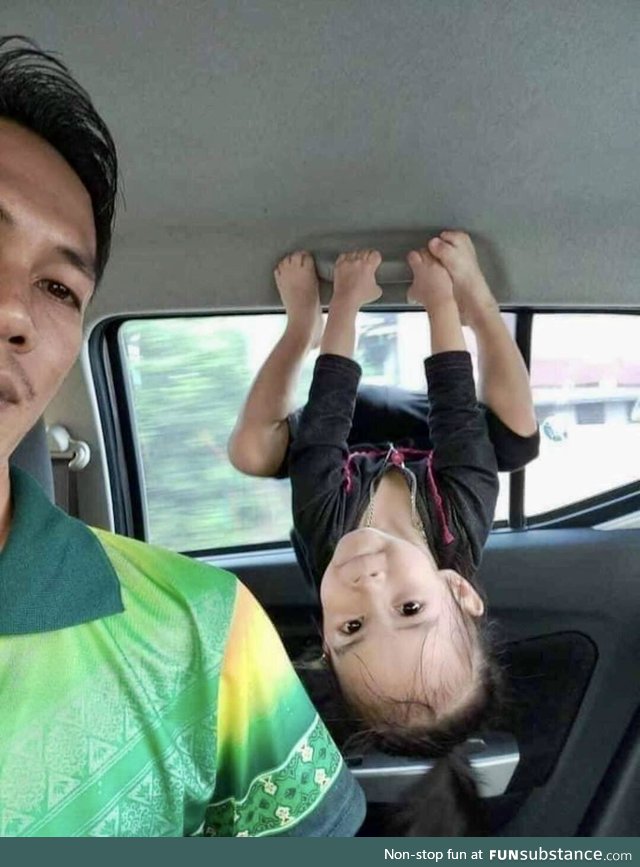 This little girl doing her best Batgirl impression with her dad