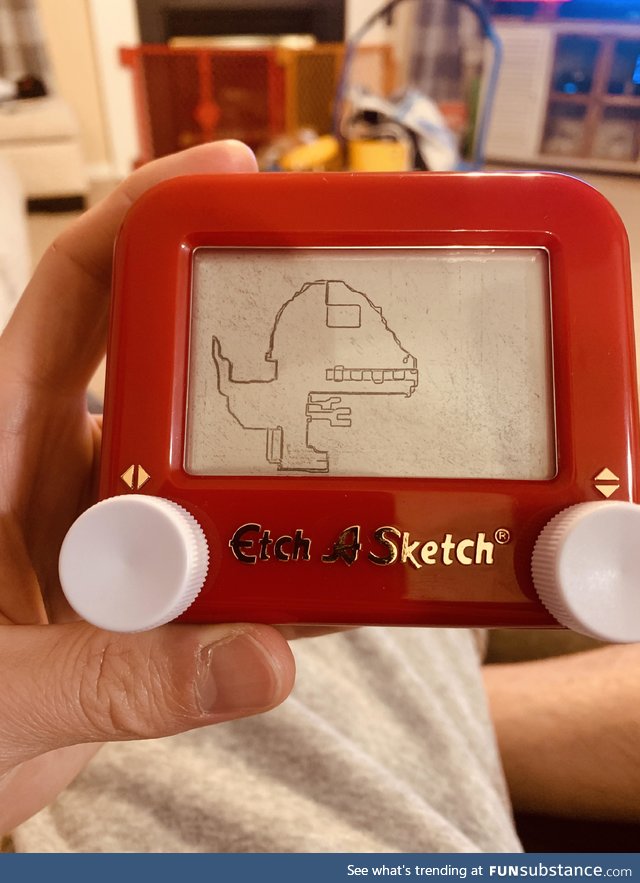 My 2 year old son asked me to draw a Velociraptor for him on his mini Etch A Sketch