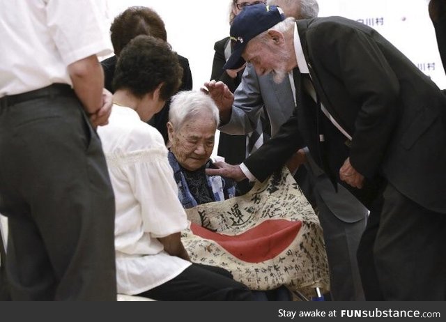 US marine returning a flag to a fallen Japanese soldier’s family. This is the only